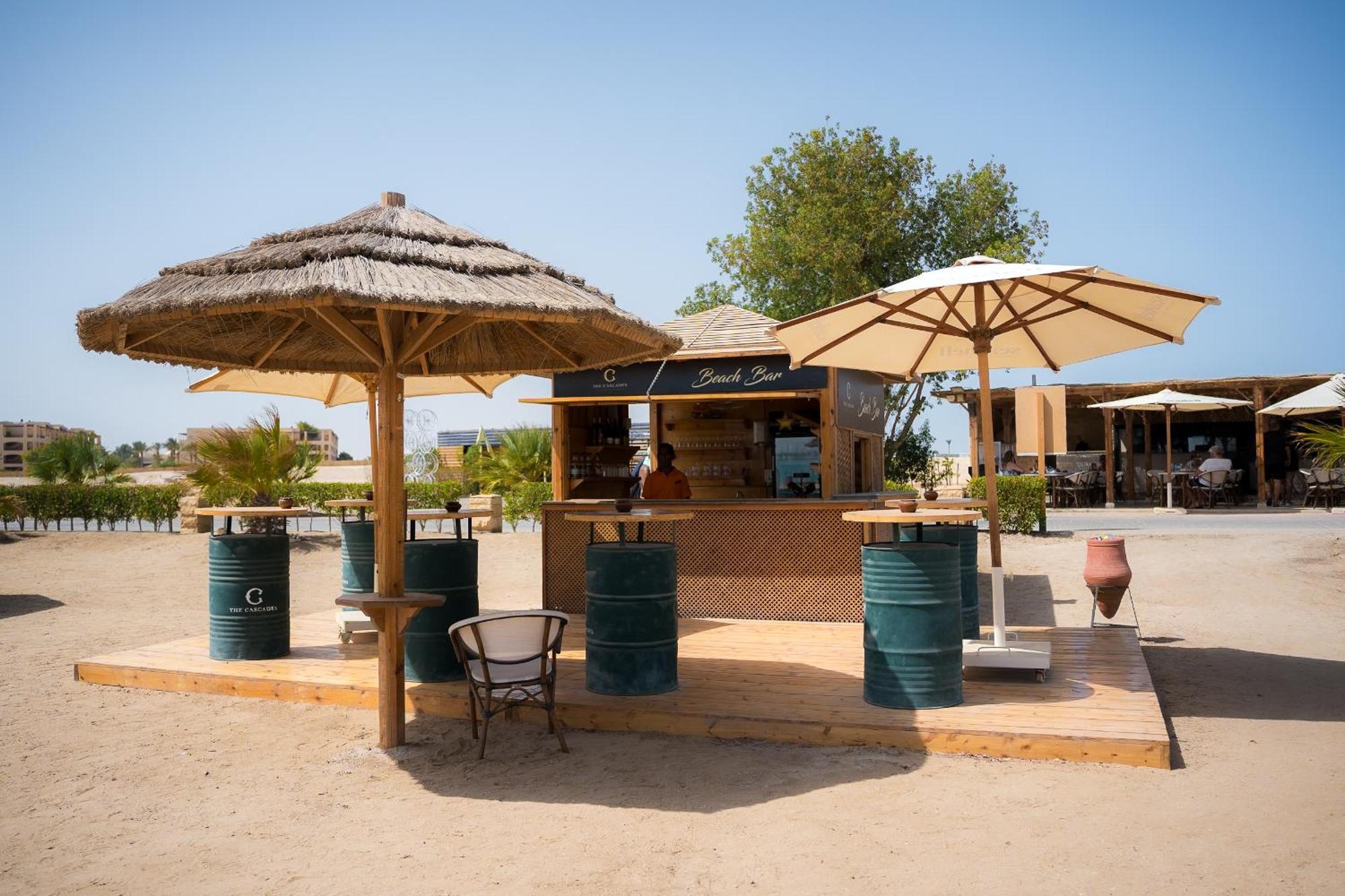 The Cascades Golf Resort, Spa & Thalasso Soma Bay Eksteriør bilde Beach bar in Cala Galdana, La Isla de San Vicente, Menorca, Spain